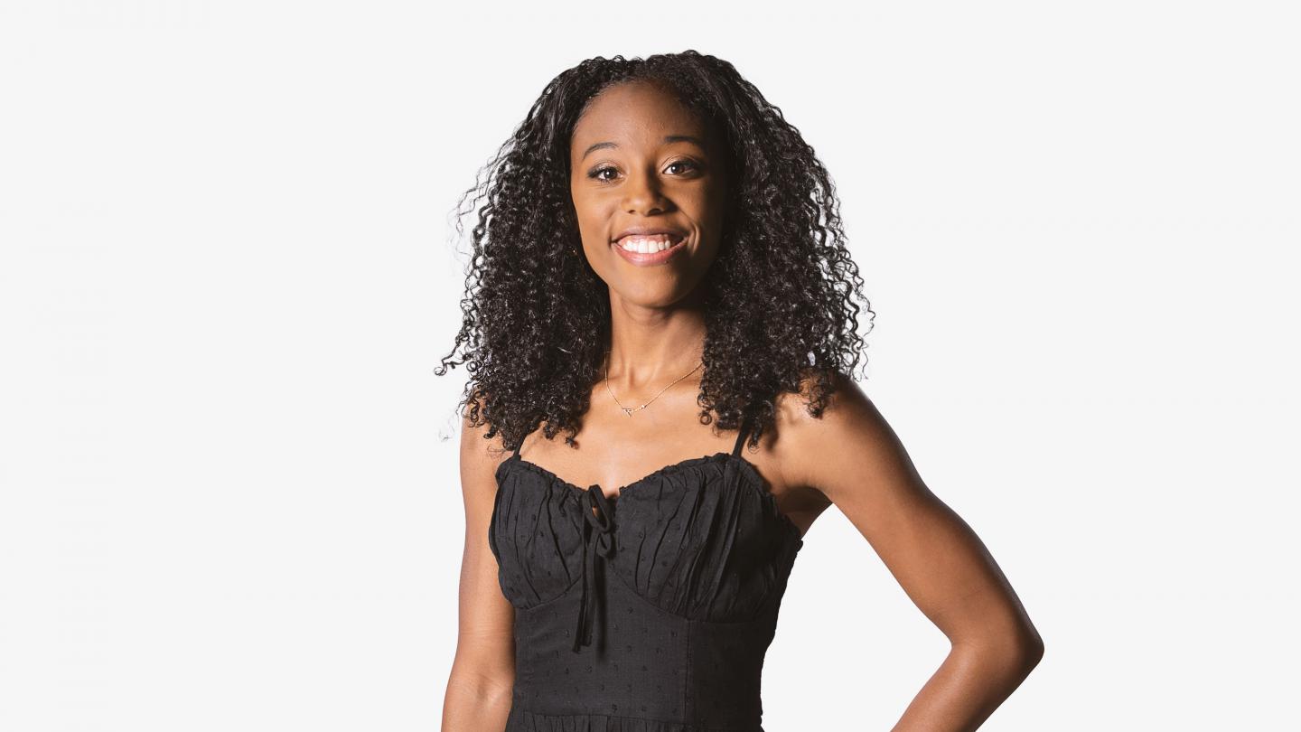 Headshot of a female dancer in a black top