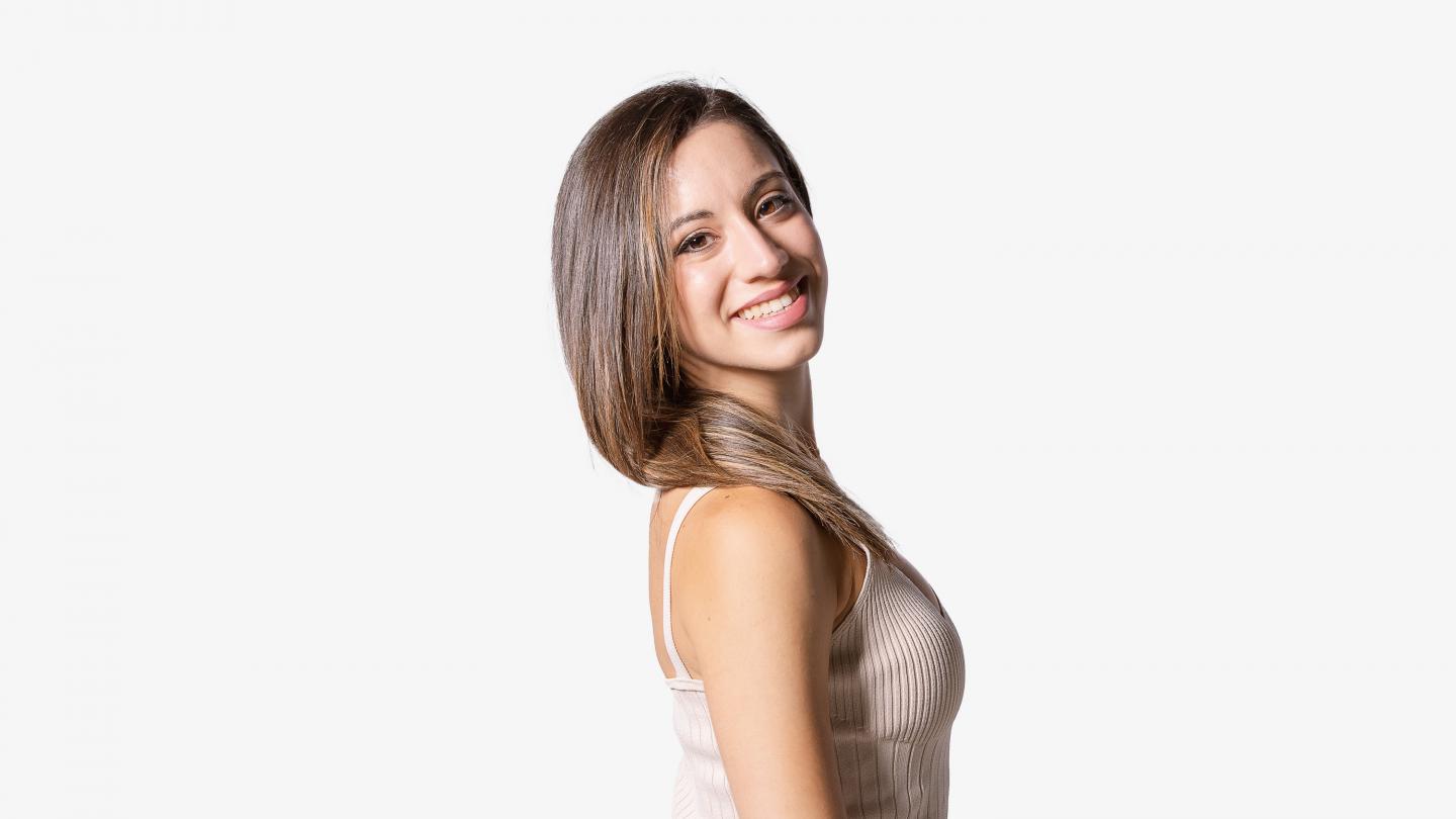 Headshot of a female dancer with long brown hair