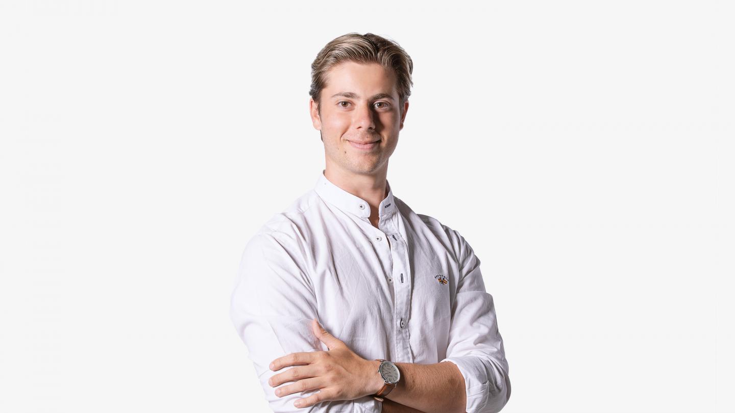 Headshot of male dancer in a white shirt