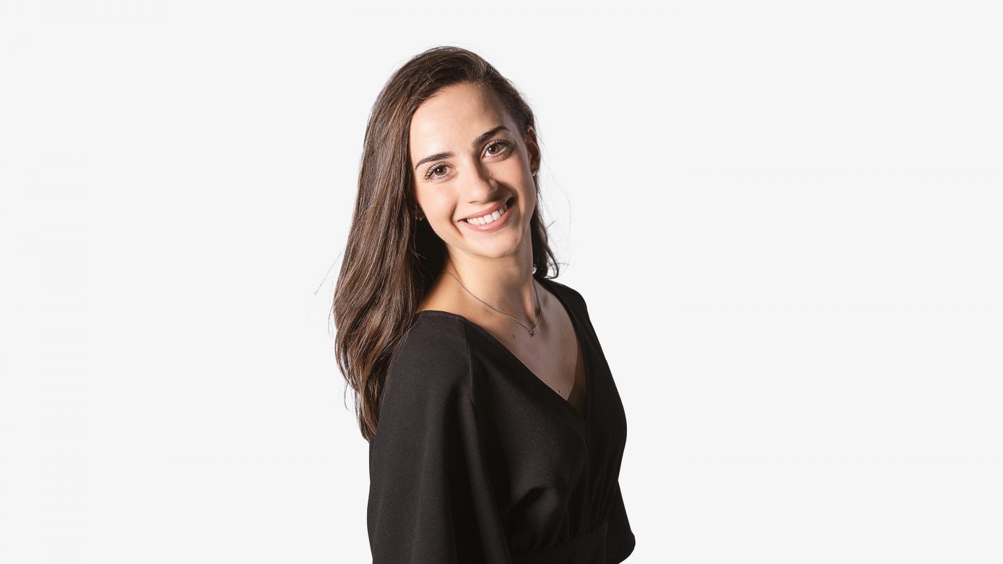 Headshot of a female dancer in a black top