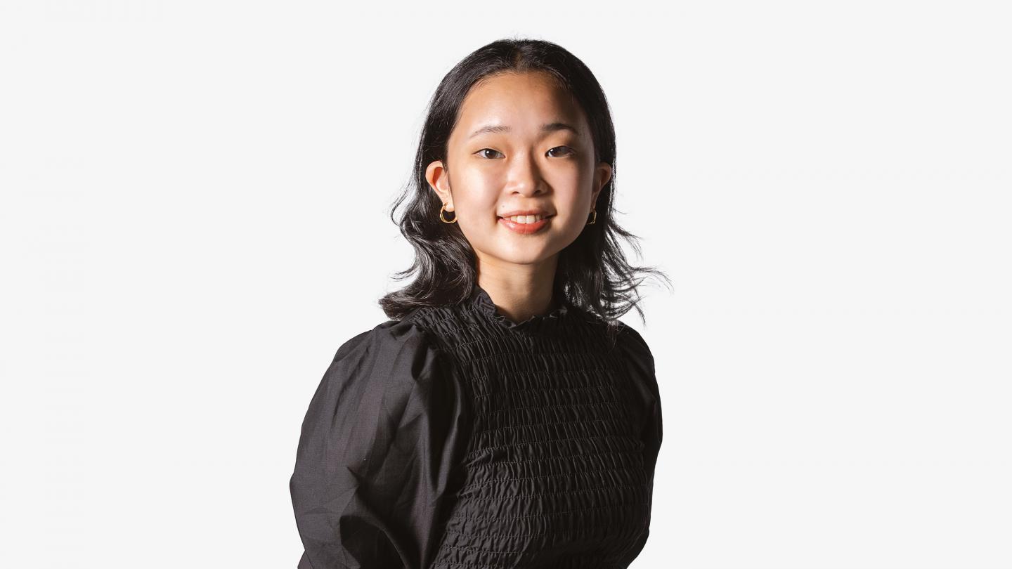 Headshot of a female dancer in a black top