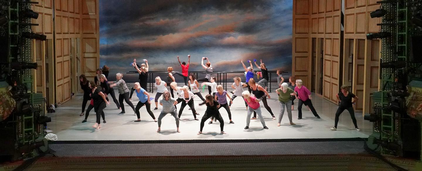 People dancing on a stage as part of a workshop