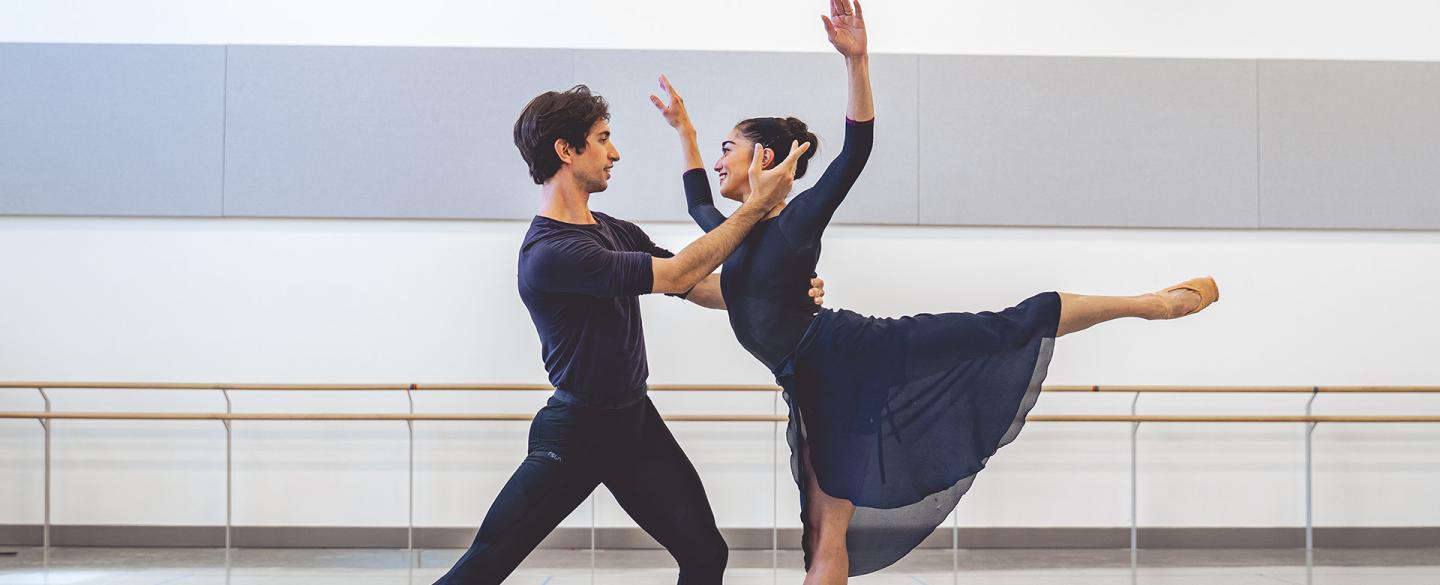 Male and female dancer rehearsing their roles in Merlin expressing love for each other