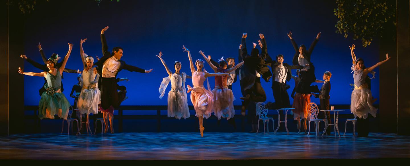 Dancers leaping in unison