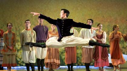 Northern Ballet dancer Matthew Koon as the young Prince leaping through the air as he entertains at the grand picnic. Photo Emma Kauldhar.