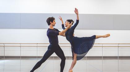 Male and female dancer rehearsing their roles in Merlin expressing love for each other