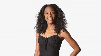 Headshot of a female dancer in a black top