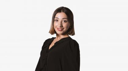 Headshot of a female dancer in a black top