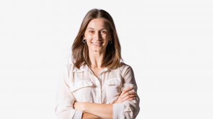 A headshot of a female dancer in a white shirt