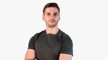 Headshot of a male dancer in a dark t-shirt